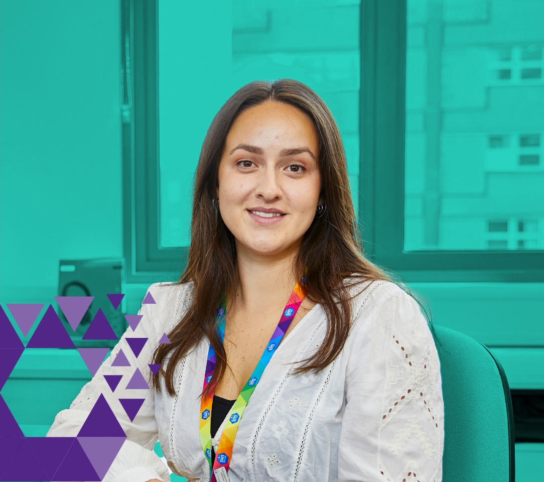 Woman in office with lanyard