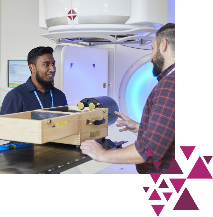 Two men talking in a hospital imaging room