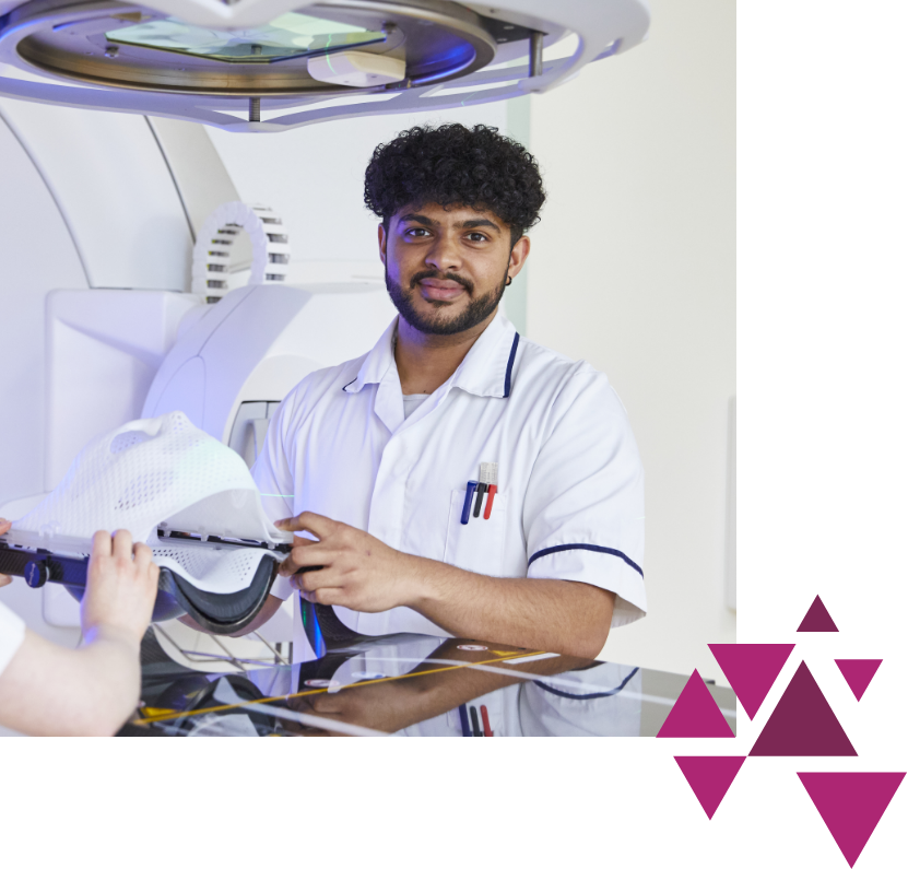 Male healthcare worker adjusting equipment in radiology room