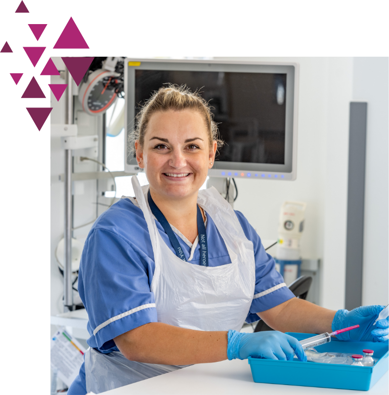 Nurse smiling at the camera providing patient support