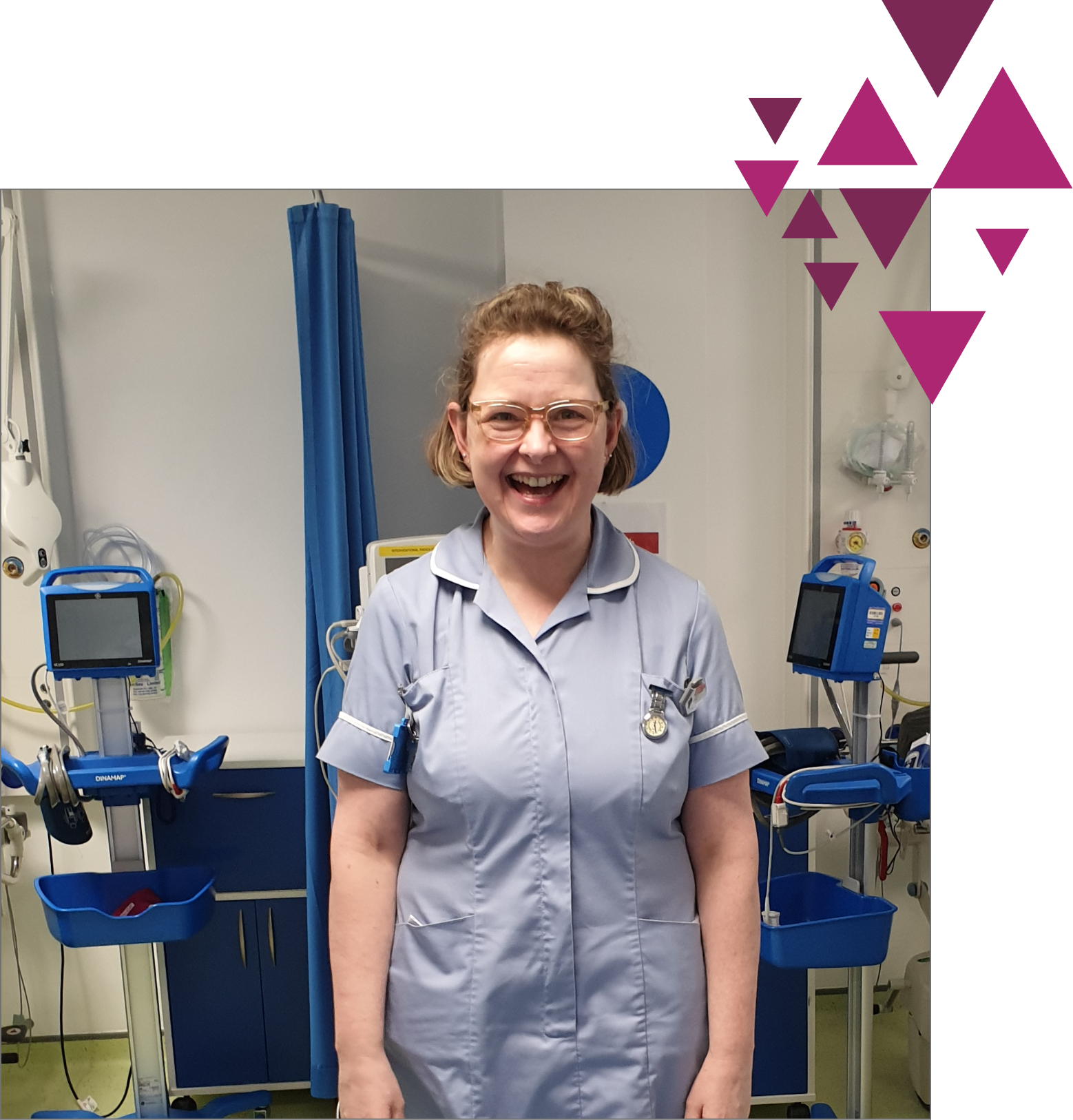 Smiling nurse in blue uniform in hospital room with pink accents.