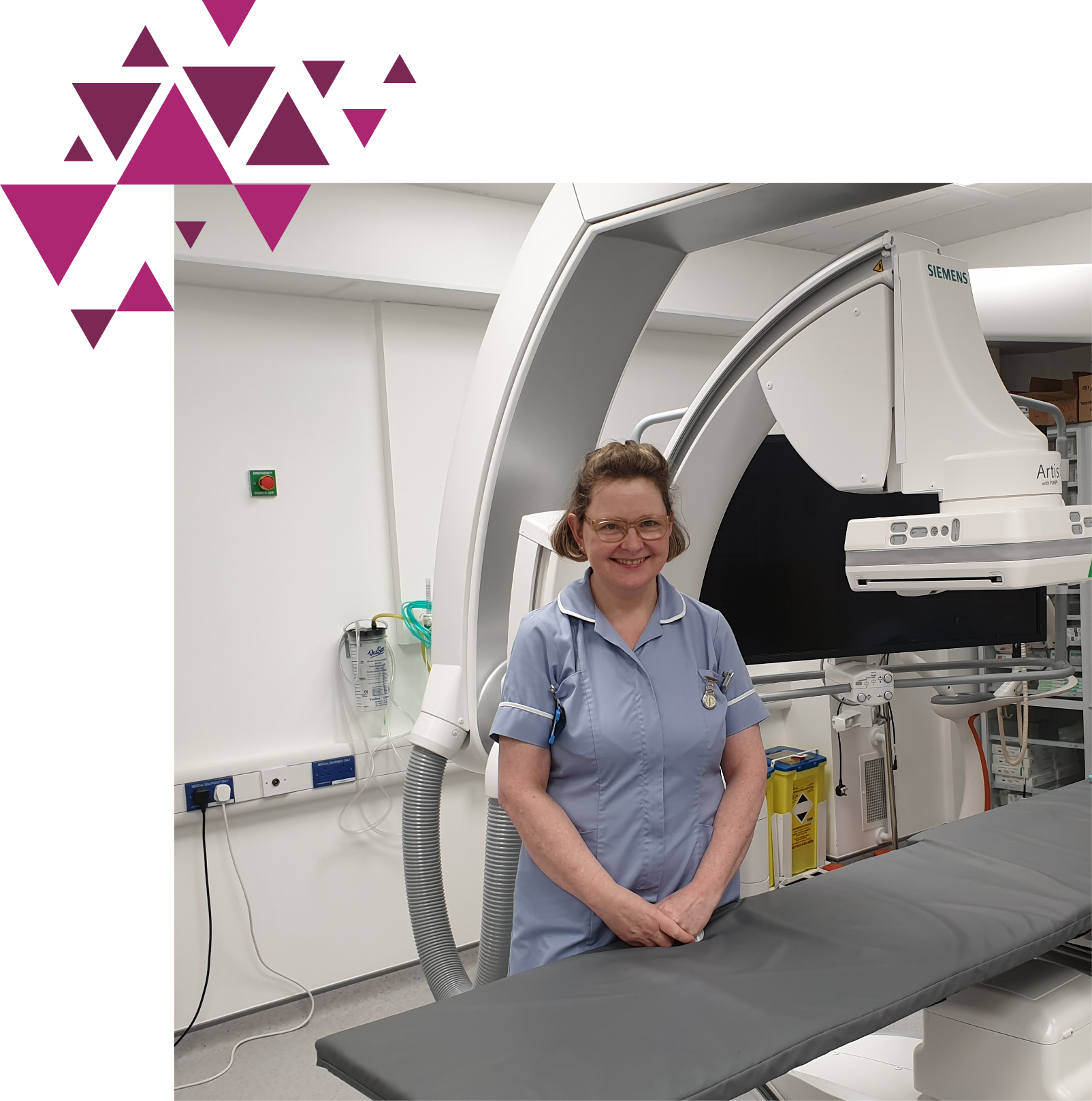 Nurse standing in a clinical setting with medical equipment.